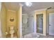 Well-maintained bathroom featuring a glass shower and separate toilet area at 2611 State Road 557, Lake Alfred, FL 33850