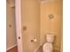 Clean bathroom featuring a toilet, and neutral color scheme at 2611 State Road 557, Lake Alfred, FL 33850