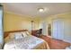 Bedroom with hard wood floors, a window, and a closet at 2611 State Road 557, Lake Alfred, FL 33850