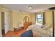 Bedroom featuring hard wood floors, a window, and a dresser at 2611 State Road 557, Lake Alfred, FL 33850