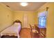 Comfortable bedroom with a single bed, desk, and window at 2611 State Road 557, Lake Alfred, FL 33850