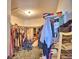 Walk-in closet with shelving and hanging space for organized storage at 2611 State Road 557, Lake Alfred, FL 33850