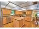 Large kitchen with granite countertops, stainless appliances, and an island at 2611 State Road 557, Lake Alfred, FL 33850