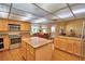 Open kitchen layout featuring granite countertops and stainless steel appliances at 2611 State Road 557, Lake Alfred, FL 33850