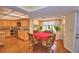 Eat-in kitchen with stainless appliances, granite counters, and large bay windows at 2611 State Road 557, Lake Alfred, FL 33850
