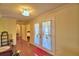 Living room with view of a bedroom and French doors to the pool, and hardwood style flooring at 2611 State Road 557, Lake Alfred, FL 33850