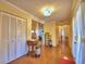 Living room with hardwood style flooring and view of the fireplace and dining room at 2611 State Road 557, Lake Alfred, FL 33850