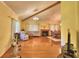 Spacious living area with wood flooring, fireplace, and natural light at 2611 State Road 557, Lake Alfred, FL 33850