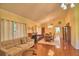 Bright living room featuring a fireplace, sofa, and dining area at 2611 State Road 557, Lake Alfred, FL 33850