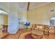 Living room with vaulted ceilings, hardwood style flooring and an accent rug at 2611 State Road 557, Lake Alfred, FL 33850