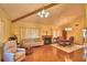 Cozy living room with wooden floors, fireplace, and ample seating at 2611 State Road 557, Lake Alfred, FL 33850