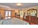 Spacious main bedroom features hardwood floors, ensuite bathroom, and private access to the outdoor pool at 2611 State Road 557, Lake Alfred, FL 33850