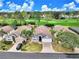 Aerial view showcasing well-maintained homes and the community's beautiful golf course at 2721 Kokomo Loop, Haines City, FL 33844