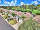 Aerial view of the community with well-manicured lawns, and mature trees at 2721 Kokomo Loop, Haines City, FL 33844