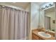 Clean bathroom with a vanity, sink, and shower featuring a shower curtain at 2721 Kokomo Loop, Haines City, FL 33844