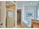 Bright bathroom with a large soaking tub and a glass enclosed shower at 2721 Kokomo Loop, Haines City, FL 33844