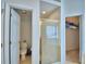 Bathroom with glass shower, toilet room and closet. Doorway leading to the bedroom at 2721 Kokomo Loop, Haines City, FL 33844