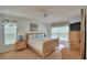 Serene bedroom with light wood furniture, soft bedding, and natural light from the windows at 2721 Kokomo Loop, Haines City, FL 33844