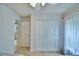 This bedroom offers a double-door closet and an entryway to the rest of the home at 2721 Kokomo Loop, Haines City, FL 33844