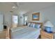 Cozy bedroom featuring light-colored furniture and comfortable furnishings at 2721 Kokomo Loop, Haines City, FL 33844
