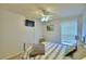 Bright bedroom with a ceiling fan and a large window with blinds at 2721 Kokomo Loop, Haines City, FL 33844