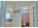 View from the hall through the bedroom door with two twin beds and the bathroom at 2721 Kokomo Loop, Haines City, FL 33844
