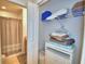 Organized closet with shelves and storage for linens and personal items at 2721 Kokomo Loop, Haines City, FL 33844