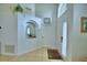 Bright entryway featuring tile floors, high ceilings, and decorative architectural details at 2721 Kokomo Loop, Haines City, FL 33844