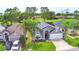 A well-maintained single-story home with a two-car garage, green lawn and located on a golf course at 2721 Kokomo Loop, Haines City, FL 33844