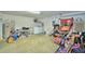 Spacious garage interior with laundry area and lots of storage at 2721 Kokomo Loop, Haines City, FL 33844