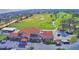 Stunning aerial view of the golf course and clubhouse with well-manicured greens and lush landscaping at 2721 Kokomo Loop, Haines City, FL 33844