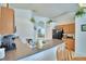 Bright kitchen features updated appliances, a breakfast bar, and ample counter space at 2721 Kokomo Loop, Haines City, FL 33844