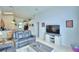 Open-concept living room with views into the kitchen and dining areas, perfect for entertaining at 2721 Kokomo Loop, Haines City, FL 33844