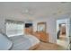 Comfortable bedroom with a full mirror and windows at 2721 Kokomo Loop, Haines City, FL 33844