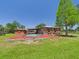 Backyard featuring a sparkling pool and covered area, perfect for outdoor enjoyment at 2726 Prine Rd, Lakeland, FL 33810