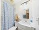 Bathroom with a white vanity, mirror and decorative touches at 2726 Prine Rd, Lakeland, FL 33810