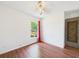 Bright bedroom with hardwood floors, a ceiling fan, and a window view at 2726 Prine Rd, Lakeland, FL 33810