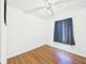 A well lit bedroom with wood floors and ceiling fan at 2726 Prine Rd, Lakeland, FL 33810