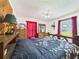 Bedroom boasts wood floors, natural light, and rustic decor at 2726 Prine Rd, Lakeland, FL 33810