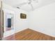 This bedroom has hardwood floors and a ceiling fan at 2726 Prine Rd, Lakeland, FL 33810