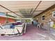 Long carport with a boat parked underneath, connected to brick building at 2726 Prine Rd, Lakeland, FL 33810