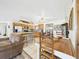 Kitchen area featuring stainless steel appliances, a dining table and wood cabinets at 2726 Prine Rd, Lakeland, FL 33810
