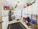 Spacious laundry room offering utility and storage, with a washer, dryer, and ample shelving at 2726 Prine Rd, Lakeland, FL 33810