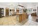 Open concept living area with center island, featuring a dining area and cozy living space at 2726 Prine Rd, Lakeland, FL 33810