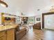 Spacious living room with wood accents, stone fireplace, natural light, and comfortable seating at 2726 Prine Rd, Lakeland, FL 33810