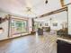 Bright living space with wood details, lots of seating, and an open view out to the front yard at 2726 Prine Rd, Lakeland, FL 33810