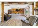 Charming living space with rustic wood beam accents, stone decor, a large window, and comfortable seating at 2726 Prine Rd, Lakeland, FL 33810