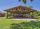 Outdoor patio with rustic wooden beams and metal roof offering a covered space for recreation at 2726 Prine Rd, Lakeland, FL 33810