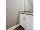 Bathroom vanity with granite countertop, white cabinets, and modern fixtures at 310 N 1St Ave, Bartow, FL 33830