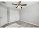 Bright bedroom featuring carpet, a closet with bi-fold doors, and neutral paint at 310 N 1St Ave, Bartow, FL 33830